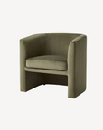 Green velvet armchair on a white background