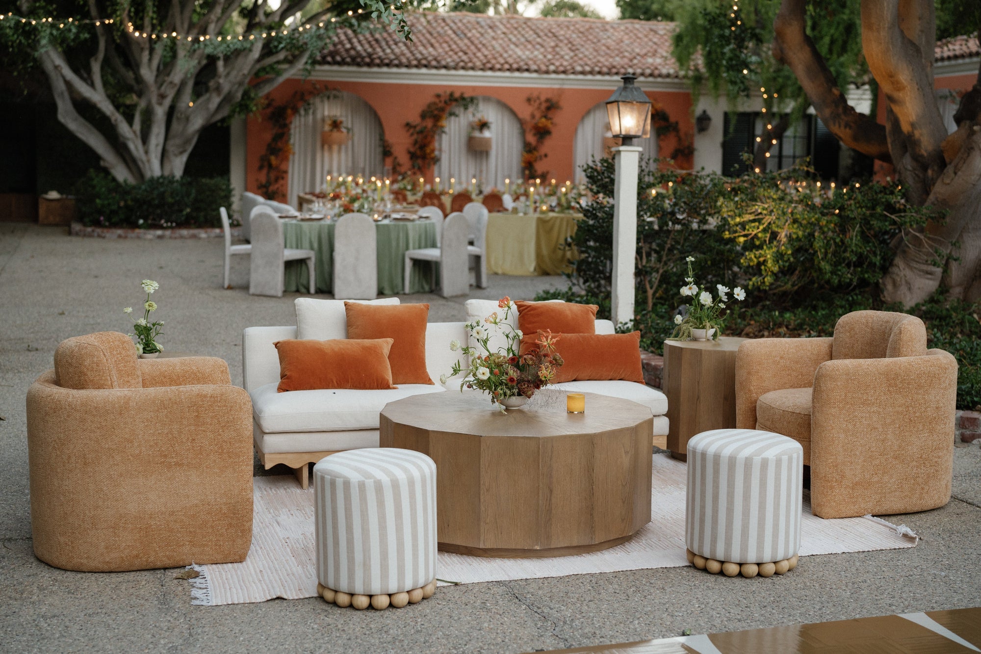 lounge seating for event with white sofa, accent chairs and coffee table